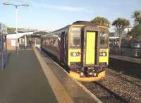 Bring me sunshine - exceptional weather for the time of year, but at Newquay, not Morecambe. The single car diesel unit, no. 153318, will soon travel back to Par on 29 November. The palm trees on the right certainly add 'That Riviera Touch'.<br><br>[Ken Strachan 29/11/2014]