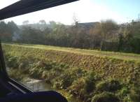 Dead straight and level, but a bit short of stone blocks - this could be flood defence, but looks very much like the tramway past St Blazey depot. Photographed on 29 November 2014 from a Newquay to Par branch train. [Ref query 4769] [Railscot note: may simply be an embankment of the former canal seen here.]<br><br>[Ken Strachan 29/11/2014]