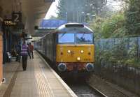 DRS operated on behalf of Northern, 47818 enters Salford Crescent on 29 November 2014 with the 1352 from Manchester Victoria to Chorley extra service to assist with moving the extra passengers on Saturdays in and out of Manchester.<br><br>[John McIntyre 29/11/2014]