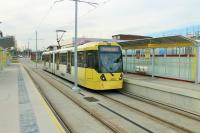 Wythenshawe Town Centre is one of fourteen intermediate stops on the Metrolink line to Manchester Airport, which opened in November 2014. The line was originally planned as a loop that would have also served Wythenshawe Hospital but funding for that is not yet in place and an <I>out and back</I> branch service operates. M5000 3072 calls at the new stop on its way to Cornbrook. <br><br>[Mark Bartlett 02/12/2014]