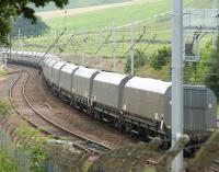 Northbound coal empties thread their way north through the station site at Abington on 11 August 2010. The locomotive at the head of the train is GBRf 66701.<br><br>[Colin Miller 11/08/2010]