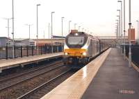 DRS 68014 working the 1Z68 Newport to Leeds via Manchester and Carnforth <I>Yuletide Yorkshire Explorer</I> passing Buckshaw Parkway on dull and damp 6 December 2014. [See image 49682]<br><br>[John McIntyre 06/12/2014]