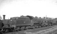 A line of locomotives in the sidings alongside Eastleigh shed on 25 September 1963 includes 'U' class 2-6-0 no 31638.<br><br>[K A Gray 25/09/1963]