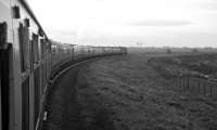 View from a window of <I>Scottish Grand Tour No. 6</I> behind D1974 on Saturday 4th January 1969 taking the single line between Longtown Jn and Mossband Jn, immediately after leaving the Waverley Route. [Ref query 6560] [See image 24154]<br><br>[Bill Jamieson 04/01/1969]