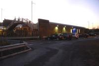 A parking and drop off area has been created on the former sidings behind the eastbound platform wall at Hexham Station as seen in this late afternoon view along the entrance road on 3 December. A DDA compliant access ramp has also been provided for disabled access to the platform .<br><br>[David Pesterfield 03/12/2014]