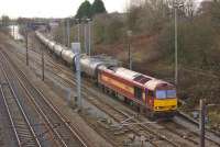 60035, still in EWS livery, joins the WCML at Farington Curve Junction on 11 December 2014 with the 6M32 loaded tar tank wagons from Lindsey Refinery to Preston Docks.<br><br>[John McIntyre 11/12/2014]