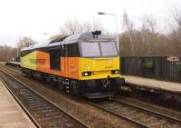 Colas 60076 passes Lostock Hall on 11 December as the OZ94 Doncaster to Preston route learning trip. This is taking place in preparation for Colas taking over the Lindsey Oil Refinery to Preston Docks workings from DBS.<br><br>[John McIntyre 11/12/2014]