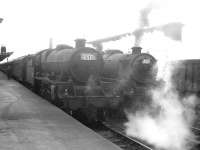 A Leeds City - Gourock special recently arrived at Carlisle platform 1 in the mid 1960s behind Jubilee 45697 <I>Achilles</I>. Standing alongside waiting to take the train forward is Kingmoor Black 5 45228.<br><br>[K A Gray //]