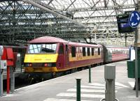 EWS 90039 at the east end of Waverley on the rear of the 11.34 departure for North Berwick on 29 December 2004. This was the period during which these push-pull services were being used to cover for multiple unit shortages on the route. What is shown here as platform 7 subsequently became platform 4 as part of the December 2006 renumbering.<br><br>[John Furnevel 29/12/2004]