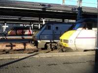 Two of a kind, plus an interloper. East Coast DVTs 82227 and 82220 stand at the west end of platforms 3 & 4 at Newcastle on 3 December, with the former on the rear of the 08.00 ex Kings Cross to Waverley and the latter leading the 09.30 ex Waverley to Kings Cross. The CrossCountry Voyager at platform 9 is the 11.35 to Southampton Central via Birmingham.<br><br>[David Pesterfield 03/12/2014]