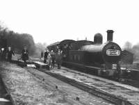 L&YR 2-4-2T no 50865 of Southport shed stands at the former West Vale station (closed to passengers 1929) with the SLS/MLS <I>'Pennine Rail Tour Special'</I> on 5th May 1951. The gentleman in the hat and long coat striding towards the boxes on the platform is the late Mr. J. E. Shaw, long time Accrington Branch Secretary of the Stephenson Locomotive Society. [Correction/resubmission - with thanks to Vic Smith and the Manchester Locomotive Society]<br><br>[W A Camwell Collection (Courtesy Mark Bartlett) 05/05/1951]