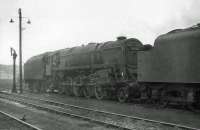 BR Standard class 9F 2-10-0 no 92120 stands in the yard at Carlisle Kingmoor shed on a grey and overcast 17 June 1964.<br><br>[John Robin 17/06/1964]