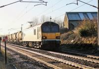 92039 <I>Johann Strauss</I> takes a long rake of China Clay tanks north through Woodacre on 3 December en route from Dollands Moor to Irvine. <br><br>[Mark Bartlett 03/12/2014]