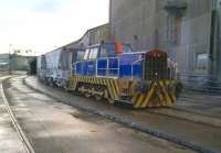 Scene at the Imerys Rocks china clay works at Goonbarrow Junction on 28th November 2014, as 0-6-0DH '<I>Isaac</I>' waits patiently for each wagon to be filled and covered [see image 49759]. <br><br>[Ken Strachan 28/11/2014]