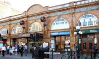 View west across Earls Court Road in June 2004 showing most of the station frontage. The banner just below the roof line still displays the names <I>'District Railway'</I> and <I>'Great Northern, Piccadilly and Brompton Railway'</I>; nowadays better known as London Underground's District and Piccadilly lines.<br><br>[John Furnevel 16/06/2004]