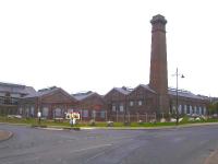 This building, located at the east end of Hood Road, Barry, featured in many views of locos at Woodham's scrapyard. Locos coming into the yard from the main line, that runs beyond the building, ran down the right side of it to enter the yard, which was located off to the left. A new Premier Inn is now sited on part of the area where they were initially processed. <br><br>[David Pesterfield 31/10/2012]