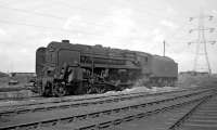 The ashpan of 9F 92063 looks as if it has just been emptied following its return to Tyne Dock shed on completion of the Saturday morning shift on 3 September 1966. Just eleven weeks after this picture was taken, 92063 (but in much better external condition) had the honour of heading the last steam hauled iron ore train to Consett.<br><br>[Bill Jamieson 03/09/1966]