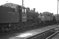 Ivatt Class 2 2-6-0 No. 46470 (with classmate 46522 beyond) in store at Carlisle Upperby MPD on Sunday 27th August 1967. Supposedly transferred from Upperby to Kingmoor on the closure of the former at the end of 1966, and withdrawn from 12A in May 1967, it seems very unlikely that the loco had ever left Upperby in the intervening period.<br><br>[Bill Jamieson 27/08/1967]
