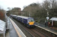 334037 forming the 1023 Cumbernauld - Dalmuir service arrives at Alexandra Parade on 23rd December 2014.<br><br>[Colin McDonald 23/12/2014]