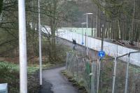 Looking north west from Tweedbank Drive along the footpath leading down to the former Waverley trackbed on 26 December 2014. The route is shared by cyclists, pedestrians, the occasional eejit and the new Borders Railway, with the latter now separated by a serious metal fence. Just off picture to the left is the Red Bridge over the Tweed leading to Galashiels, while a short distance to the right is the site of the new Tweedbank station.<br><br>[John Furnevel 26/12/2014]