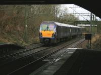 334037 bound for Dalmuir has just cleared the arched bridge at Alexandra Parade on the morning of 23rd December 2014.<br><br>[Colin McDonald 23/12/2014]