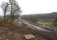 Looking south from Winston Road, Galashiels, on 26 December, with the new road bridge having recently been opened to vehicles. The pedestrian route between Winston Road and Tweedbank via the Red Bridge in the distance is now on the right (west side) of the trackbed, with the old route, visible beyond the barriers on the far left, now closed off. <br><br>[Ewan Crawford 26/12/2014]