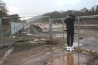 <I>Not another eejit surely?</I> HJF testing out his favourite Christmas present - a folding lightweight portable step-stool! Beyond the fence is the Tweedbank station site, with platform work well advanced. View north from the buffer stops towards Galashiels on 26 December 2014.<br><br>[Ewan Crawford 26/12/2014]