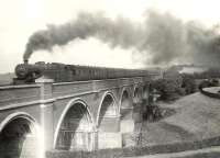 The 5.12pm Glasgow Central - Uplawmoor train crossing Waulkmill Glen Viaduct near Patterton on 11 July 1956. At the head of the train is Fairburn 2-6-4 tank 42238. <br><br>[G H Robin collection by courtesy of the Mitchell Library, Glasgow 11/07/1956]