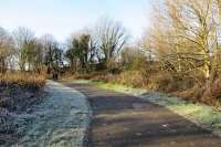 At the end of the trackbed path looking west. Ahead the infilled bridge under the Ayr - Dunure A719 - from the other side of the blockage, [see image 49868]. To the left, the site of Greenan Siding.<br><br>[Colin Miller 28/12/2014]