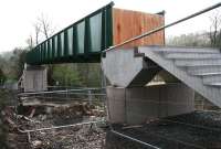 The new footbridge under construction on Plumtreehall Brae, replacing the road bridge that previously crossed the railway here. View south west towards the A72 King Street on 26 December. [See image 49909]<br><br>[John Furnevel 26/12/2014]