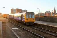 Northern 142037, on a Wigan to Manchester Victoria local service, pulls away from its penultimate stop at Salford Central on 2nd December. Electrification masts are starting to appear around Salford and the Pacers should be the first units to go when the EMUs arrive.<br><br>[Mark Bartlett 02/12/2014]