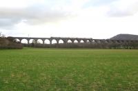 With Bosley Cloud marking the boundary of the Cheshire Plain and the Peak District, a CrossCountry Voyager traverses North Rode viaduct and the valley of the River Dane with a service from Bournemouth to Manchester.  North Rode station and the junction with the NSR Churnet Valley line to Uttoxeter were sited 500m north of the viaduct.<br><br>[Malcolm Chattwood 24/12/2014]