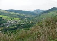 Looking Southwest down the Afan Valley in August 2002 with the trackbed of the Rhonnda and Swansea Bay line curving between the road and the river.<br><br>[John Thorn 06/08/2002]