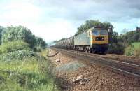 47307 lifts a heavy tank train up the Lickey Incline in 1980, with considerable assistance from two Class 37 banking engines [See image 49932]. 47307, the former D1788, was a Tinsley loco at this time. It was finally withdrawn in 2002 and cut up at EMR Kingsbury in 2008. <br><br>[Mark Bartlett 11/09/1980]