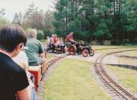 Miniature railway trains are slow and light, so line of sight operation is feasible, especially with one engine in steam. Nonetheless, the driver of the model traction engine waited to be sure that our train would stop before crossing.<br><br>[Ken Strachan 31/05/2010]