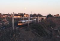 A 318/320 EMU pairing on the 1539 service to Milngavie, leaving Baillieston in fading light on 3rd January 2015.<br><br>[Colin McDonald 03/01/2015]