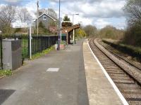 Looking north east at Garth station, on the Heart of Wales line south of Llandindrod Wells, in April 2012. The former down platform is still mainly extant, with cable troughing now running along the solum of the down line.<br><br>[David Pesterfield /04/2012]