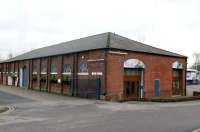 With the rather uninspiring design of the station just visible in the background, the more attractive proportions and detail of the well preserved North Staffordshire Railway goods shed at Congleton are shown to advantage. Its condition is a credit to its owners.<br><br>[Malcolm Chattwood 22/12/2014]