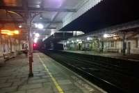 Platform scene at Kemble station on a dark winter evening in January 2015, with a grand total of three waiting passengers. The late running 19.31 to Cheltenham Spa is conspicuous by its absence.<br><br>[Ken Strachan 03/01/2015]