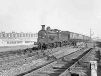 57554 approaching Clydebank Riverside on 14 September 1957 with a Rutherglen - Balloch train. The smokebox door of the Dawsholm based 0-6-0 looks in slightly better condition than in had when operating the same service 6 weeks earlier [see image 49967]. [Ref query 3446]  <br><br>[G H Robin collection by courtesy of the Mitchell Library, Glasgow 14/09/1957]