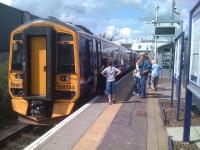 The former Bathgate station on a sunny 7 August 2009, with passengers waiting to board a mid afternoon service to Edinburgh. [See image 38438]<br><br>[Colin McDonald 07/08/2009]