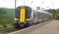 The 1218 Glasgow Central - Ardrossan Harbour formed by Scotrail EMU 380108 calls at Ardrossan South Beach on 13 August 2014.<br><br>[Ken Browne 13/08/2014]