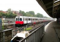 Looking out towards the District Line platforms at Ealing Broadway terminus in July 2005 with a train for Upminster at platform 7.<br><br>[John Furnevel 20/07/2005]