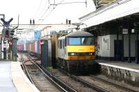 A Felixstowe - Trafford Park container train crossing the bridge over the A503 Camden Road  heading west through its namesake station on the North London Line in July 2005 behind Freightliner 90044. The train will join the West Coast Main Line just to the east of Primrose Hill Tunnel [see image 53461].<br><br>[John Furnevel 21/07/2005]