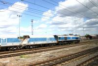 A Foster Yeoman stone train alongside Acton yard on 20 July 2005.<br><br>[John Furnevel 20/07/2005]