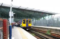 A delayed arrival from Richmond recently terminated at the 'North London Line' platforms at Stratford in July 2005 with passengers boarding for the return journey. Behind the camera the line continues to North Woolwich, scheduled to close the following year with the expanding Docklands Light Railway taking over most of the route. <br><br>[John Furnevel 22/07/2005]