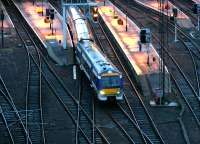 The 0800 to Glasgow Queen Street, illuminated by a harsh morning sun, leaves Waverley on 2 February 2005.<br><br>[John Furnevel 02/02/2005]