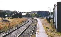 South side of Keith station in 2004 looking south-west showing the platform on the former GNSR route to Aviemore with the old yard and goods shed on the left.<br><br>[John Furnevel 12/09/2004]