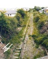 A lone walker heading east from Maxwelltown towards Dumfries in May 2003. View is north east from Terregles Road bridge with Maxwelltown station behind the camera.<br><br>[John Furnevel 27/05/2003]