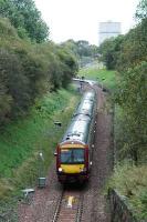 1030 service from Queen Street leaves Kelvindale and is about to pass under the Forth and Clyde Canal.<br><br>[Ewan Crawford 28/09/2005]